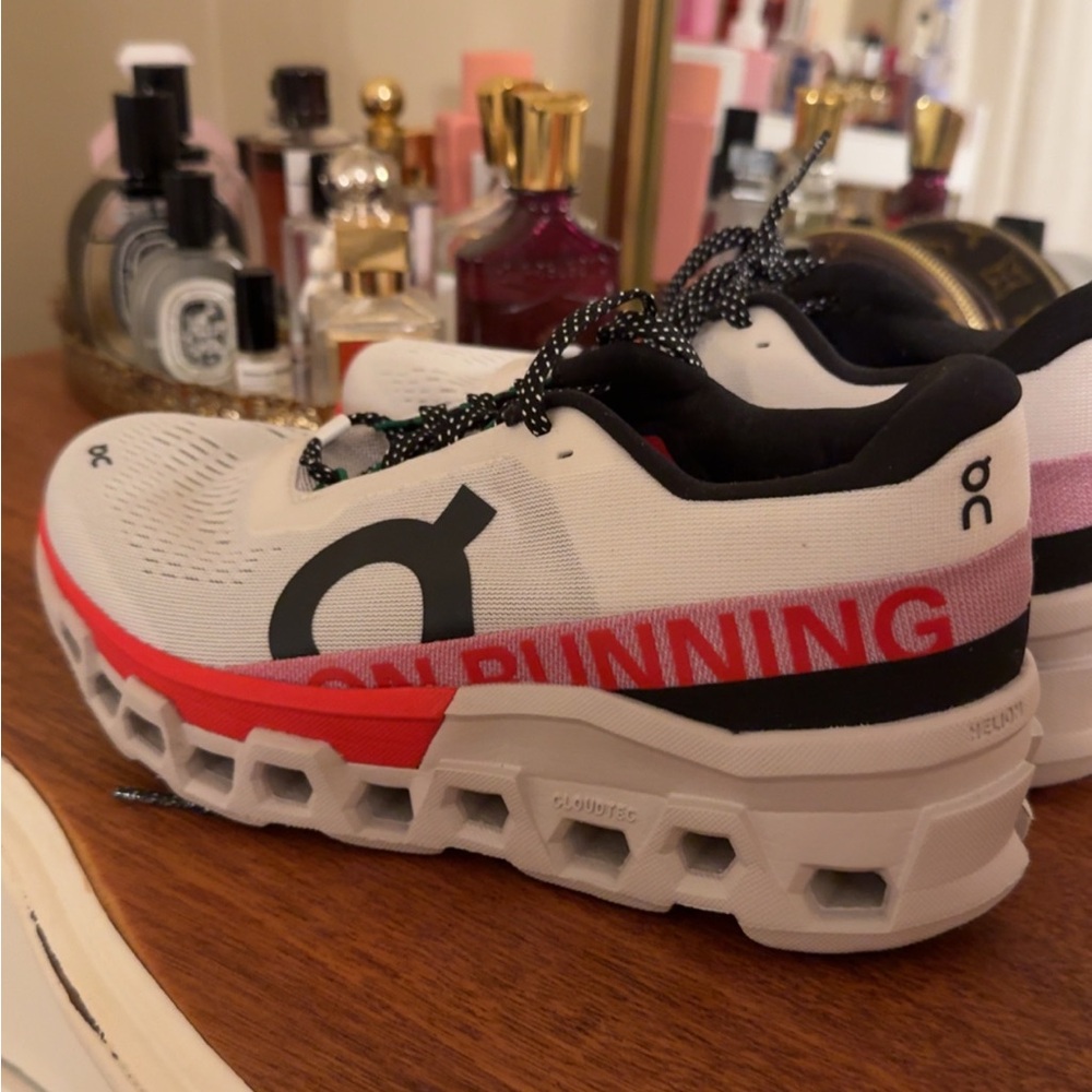 On Running White and Red Athletic Shoes